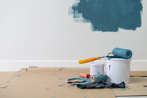 Paint Bucket and Brushes in a Room in Heritage Isles FL With Unfinished House Painting